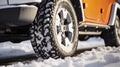 A Close-Up Look at Winter Tires Blanketed in Snow, Capturing Their Robust Design