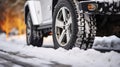 A Close-Up Look at Winter Tires Blanketed in Snow, Capturing Their Robust Design