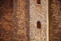 Close-up of loophole window in medieval stronghold castle tower