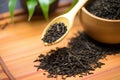 close-up of loose leaf oolong tea with a bamboo scoop Royalty Free Stock Photo