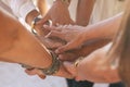 Close up with lot of women hands holding and touching each other for friendship concept - cooperation and help for caucasian