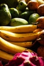 Close up of lots of exotic fresh ripe juicy fruits on wooden brown table background Royalty Free Stock Photo