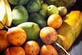 Close up of lots of exotic fresh ripe juicy fruits on wooden brown table background Royalty Free Stock Photo