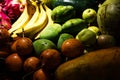 Close up of lots of exotic fresh ripe juicy fruits on wooden brown table background Royalty Free Stock Photo