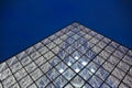 Close up Louvre glass pyramid in dark sky background, Paris, France. Royalty Free Stock Photo