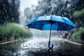 Close-up of a lovely blue umbrella with rain in the background Royalty Free Stock Photo