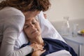 Woman kissing her mother at hospital Royalty Free Stock Photo