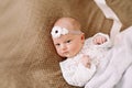 Close-up lovely newborn baby girl on a blanket. A portrait of a beautiful  newborn baby girl wearing a headband. Closeup photo Royalty Free Stock Photo