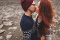 Close-up lovely portrait of young hipster couple kissing and hugging together