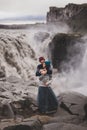 Close up lovely portrait of young hipster couple kissing together near Dettifoss