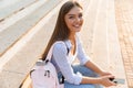 Close up of a lovely young girl with backpack