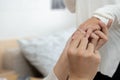 Close up of lover holding hands and wearing ring