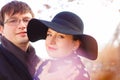 Close-up of lovers on street. portrait of man and woman in hat. sun glare Royalty Free Stock Photo