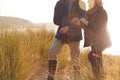 Close Up Of Loving Active Senior Couple Arm In Arm Walking Through Sand Dunes Royalty Free Stock Photo