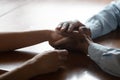 Close up of biracial couple hold hands having romantic moment Royalty Free Stock Photo