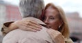 Close up of loving attractive middle-aged couple embracing outdoors Royalty Free Stock Photo