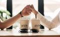 Close up Loving couple enjoying time together sitting at a coffee shop, holding hands Royalty Free Stock Photo