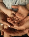 Close up of loving mom dad and kid hold hands on floor palms up together express closeness and unity, caring parents Royalty Free Stock Photo