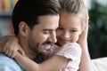 Close up loving young father hugging pretty little daughter Royalty Free Stock Photo