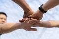 Close up low angle of business people putting their hands together. Stack of hands. Unity and teamwork concept Royalty Free Stock Photo