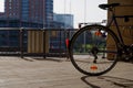 bicycle`s wheel at public parking lot. Royalty Free Stock Photo