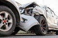 Close-up, low angle view of the front side wheels of a white car which was badly damaged Royalty Free Stock Photo