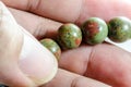 Close up lucky stone gem on hand Royalty Free Stock Photo