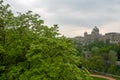 Close up of lush tree on beautiful bundeshaus of bern and cloudy sky background