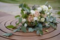 Close up of lush wedding bouquet of white flowers and greenery on wood background, copy space. Royalty Free Stock Photo