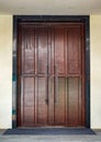 Close-up of the luxurious large wooden door of the auditorium