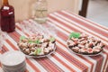 Close-up of luxurious rural-style catering table in restaurant ready for wedding celebration. Focus on pork sandwiches Royalty Free Stock Photo