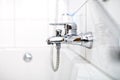 Close up of luxury bathroom tap and bathtub in contemporary home