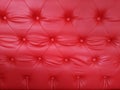 Close-up luxury red leather cushion. sofa retro. upholstery Royalty Free Stock Photo