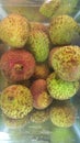 close up lychee fruits in a cold water background