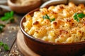 Close-up of Mac'n'Cheese in a ceramic baking dish on wooden kitchen table. Macaroni and cheese, American style Royalty Free Stock Photo