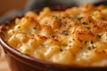 Close-up of Mac'n'Cheese in a ceramic baking dish on wooden kitchen table. Macaroni and cheese, American style Royalty Free Stock Photo