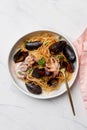 Close up. Macaroni with octopus and tomato sauce. Spaghetti with octopus and mussels in white bowl Royalty Free Stock Photo