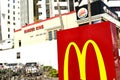 Close-up of a MacDonald sign, next to a fastfood burger king