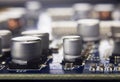 Close up macro of aluminum electrolytic capacitors installed on