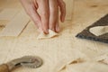 Close up macro detail of process of homemade vegan farfalle pasta with durum wheat flour. The cook kneads the dough on the wooden Royalty Free Stock Photo