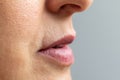 Macro detail of wrinkles around mouth of middle aged woman