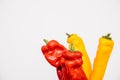 Close-up macro details bunch of sweet pepper red and yellow against a white Royalty Free Stock Photo