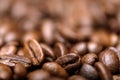 Close up macro a group roasted brown or black coffee grains background. Close up coffee beans Royalty Free Stock Photo