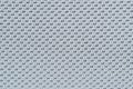 Close up macro pattern of knitt soft fiber fabric syntetic modern furniture material weave grey background