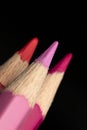 Colour pencils pink, red, purple close up macro Royalty Free Stock Photo