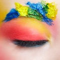 Close-up macro shot of closed teenager female eye with unusual art make-up and face painting on brows and around eye Royalty Free Stock Photo