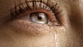 Close Up Macro Shot of a Crying Eye. Young Beatiful Female with Natural Light Blue, Yell Royalty Free Stock Photo