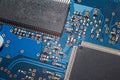 Close-up Macro Shot of Electronic Factory Machine at Work: Printed Circuit Board Being Assembled with