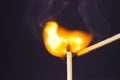 Close up Macro shot of a ignition match on a second match captured in super slow motion Royalty Free Stock Photo