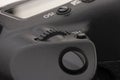 Close-up macro shot of a modern digital SLR camera. Detailed photo of black camera body with a classic wide aperture portrait lens Royalty Free Stock Photo